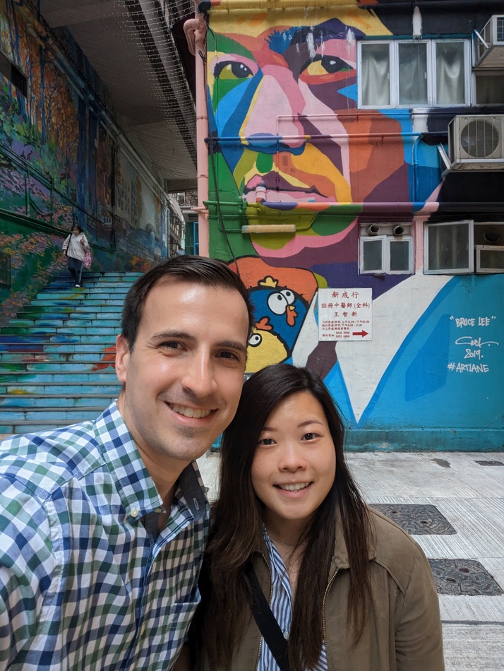 Jose and Kirsten in front of a Bruce Lee mural